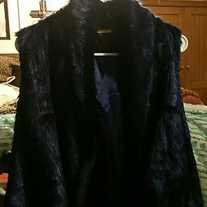 A blue fluffy vest Steve Madison